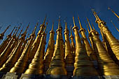 Inle Lake Myanmar. Indein, on the summit of a hill the  Shwe Inn Thein Paya a cluster of hundreds of ancient stupas. Many of them are ruined and overgrown with bushes. 